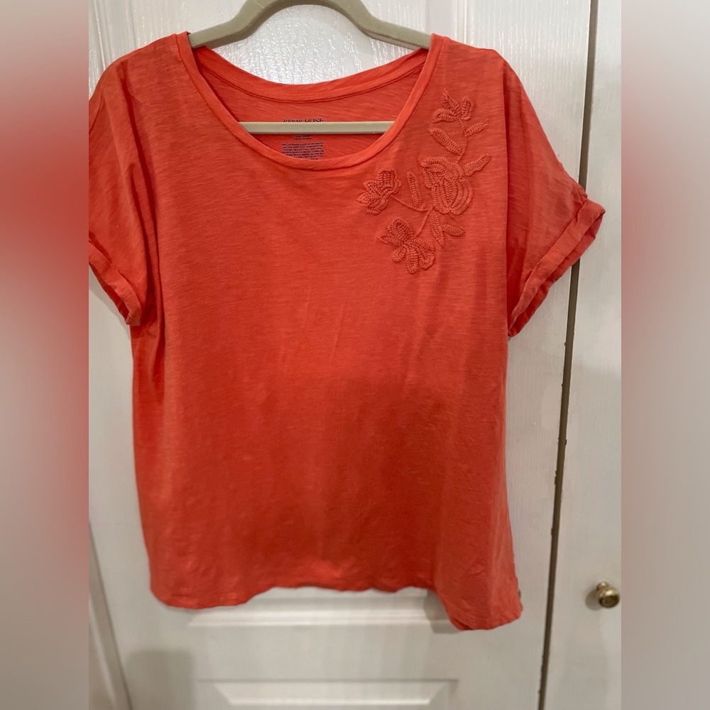 Orange tee, short sleeve, embroidery detail on front left side